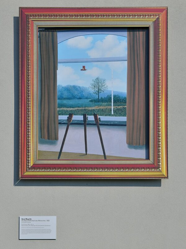 Photo of a copy of the painting “The Nature of Man” by René Magritte, 1933.